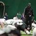 EMU head coach Ron English walks between players while they stretch on Sunday, April 14. AnnArbor.com I Daniel Brenner